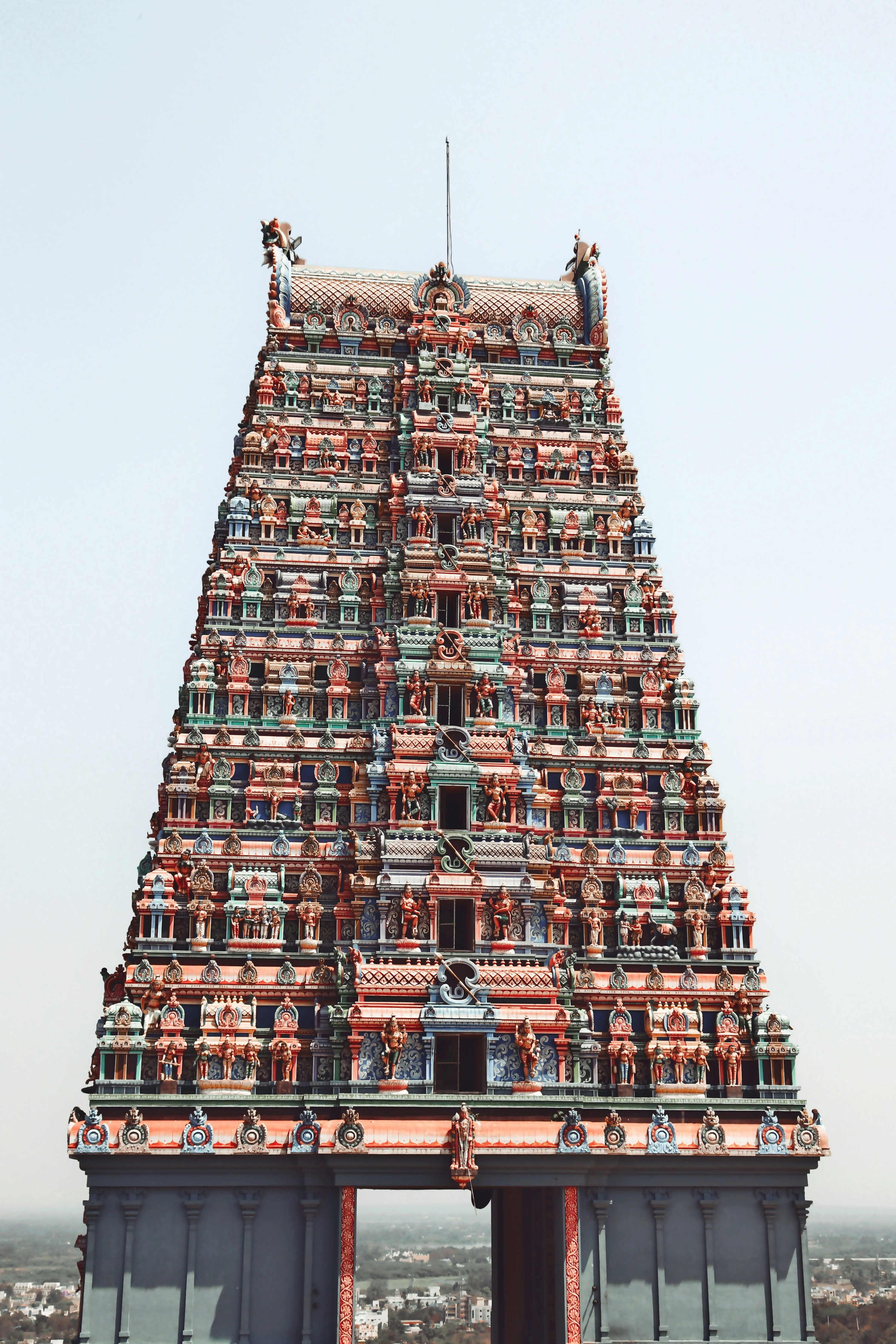 a very tall building with a lot of statues on top of it