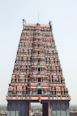 a very tall building with a lot of statues on top of it