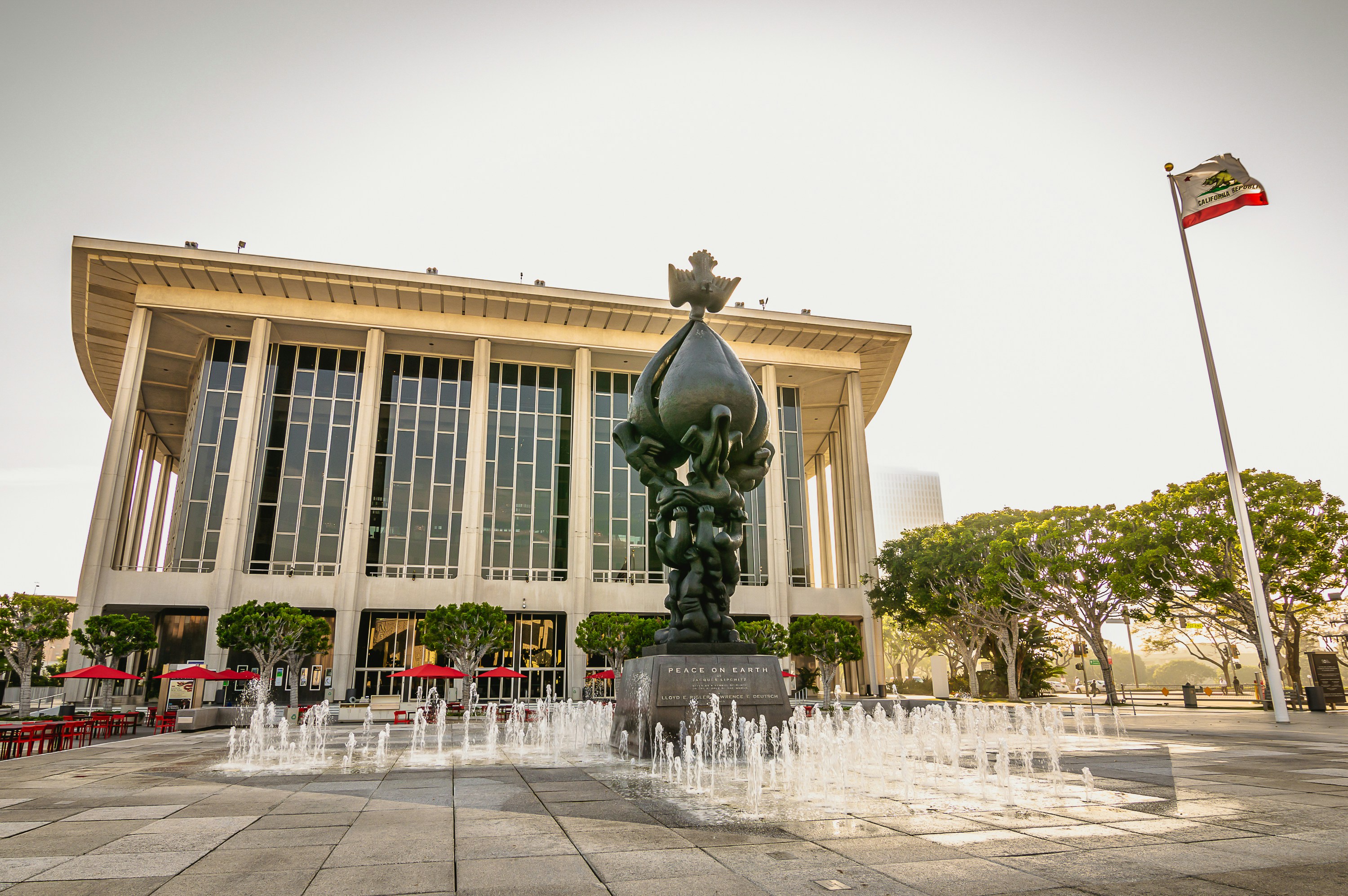 a large building with a fountain in front of it