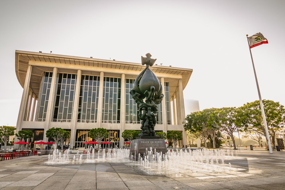 a large building with a fountain in front of it