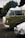 A vintage VW bus photo booth set up at an outdoor event.