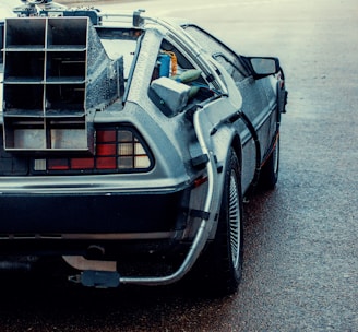 a back view of a delore of cars parked on the street