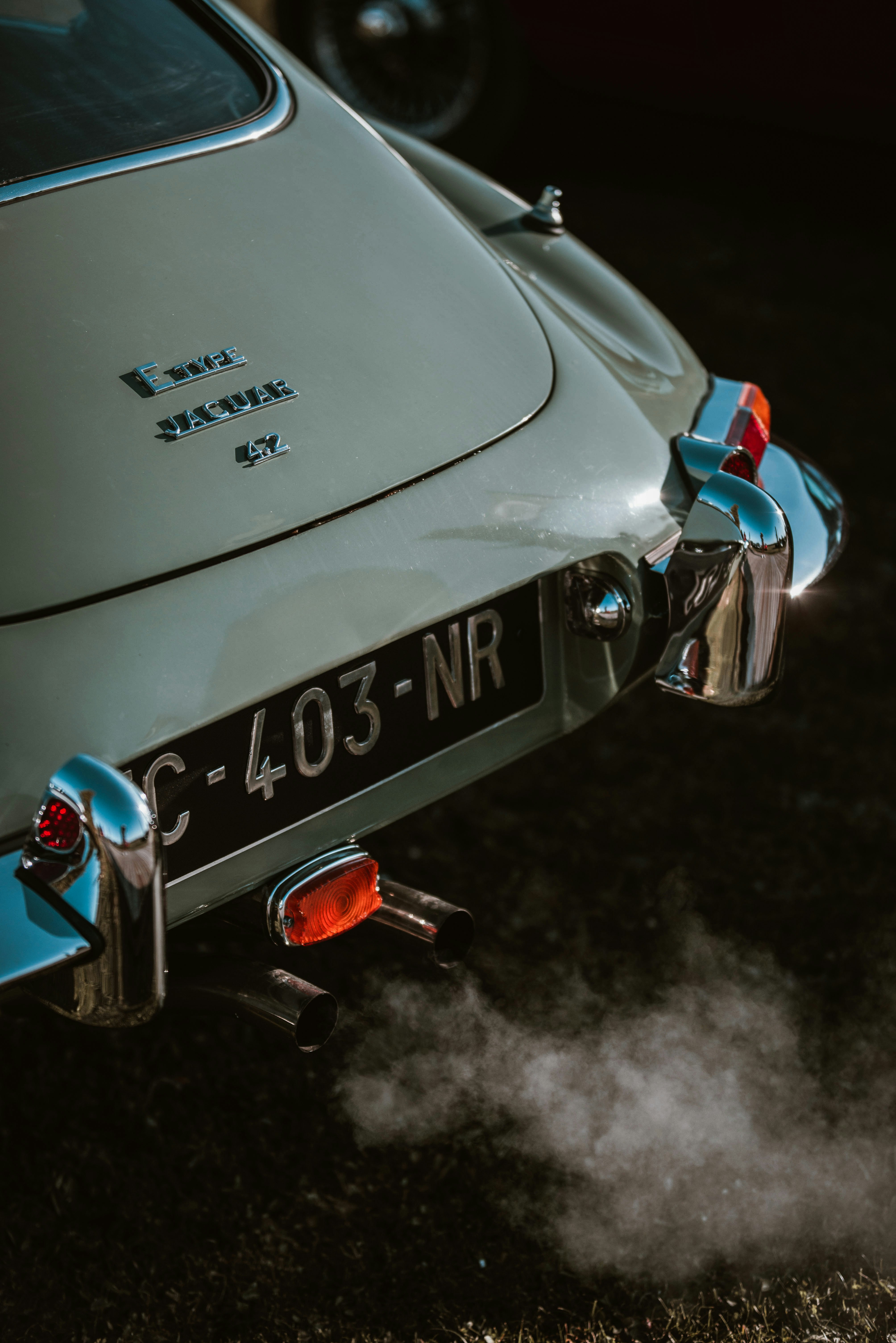 A close up of a car with smoke coming out of it photo – Free Car Image ...