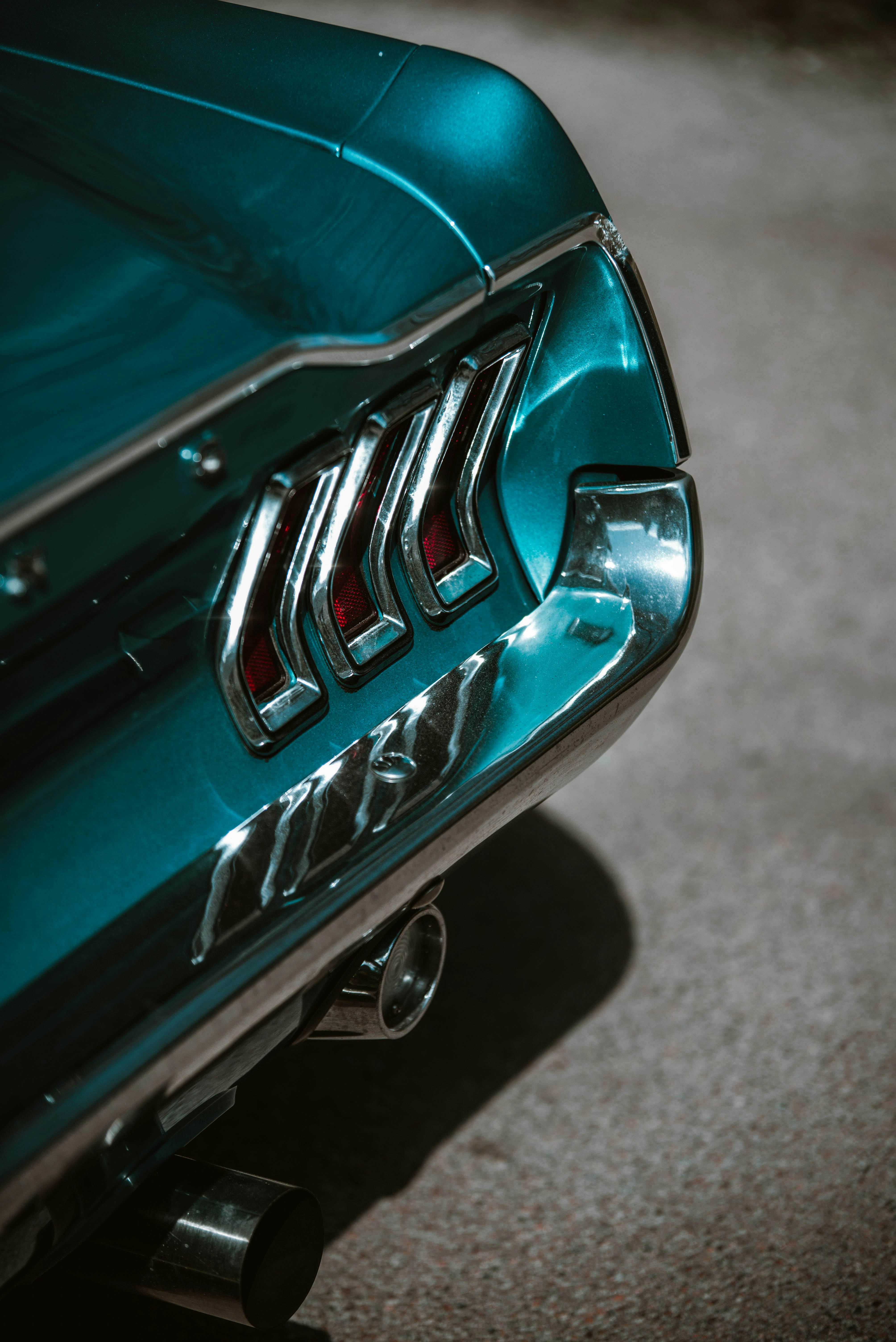a close up of the emblem on a green car