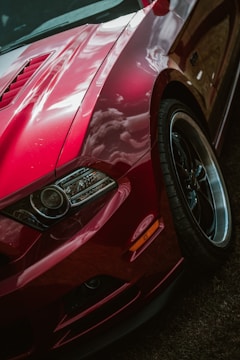 Close-up of a sleek, custom-painted sports car with gleaming details.