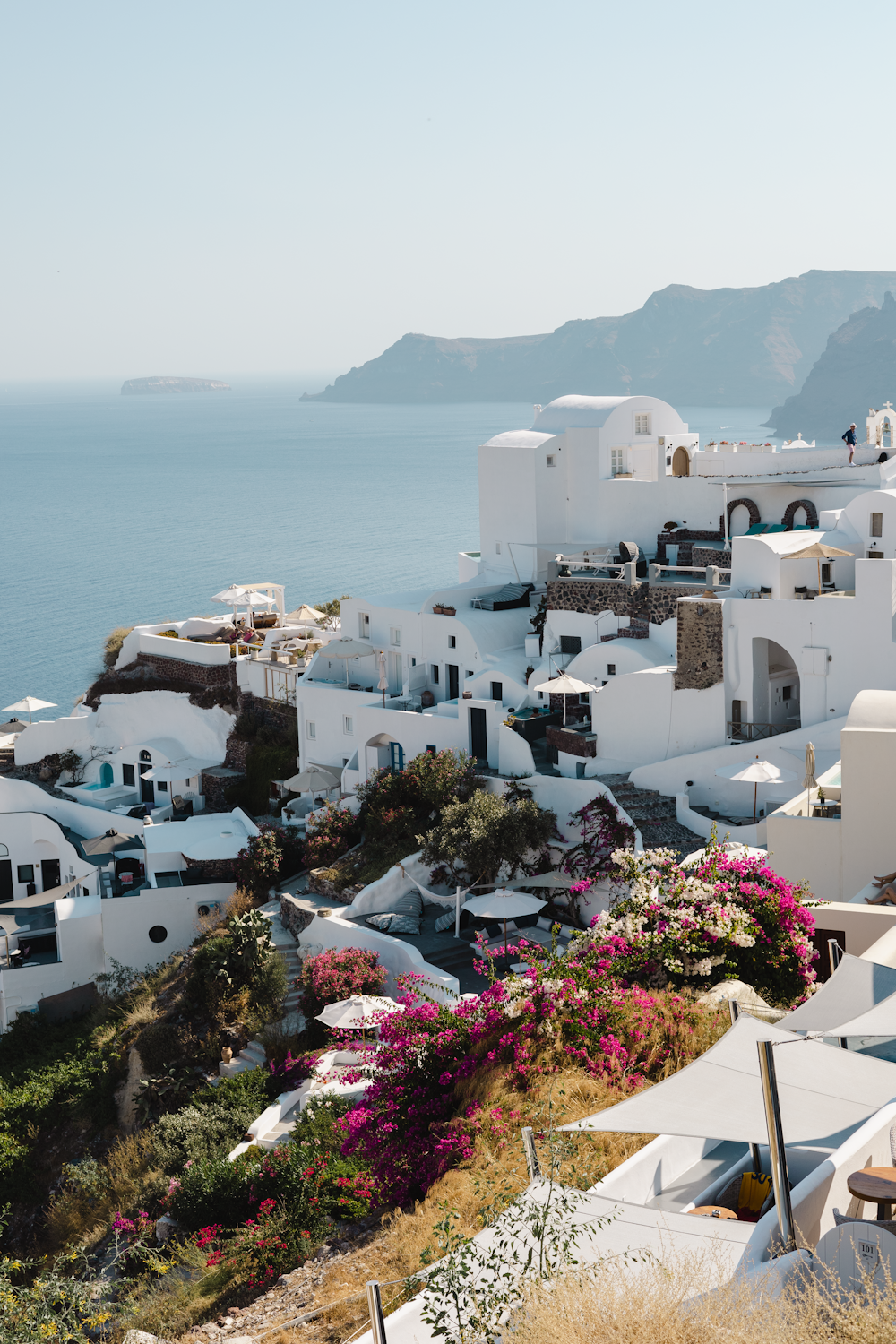 a scenic view of a white village on the coast