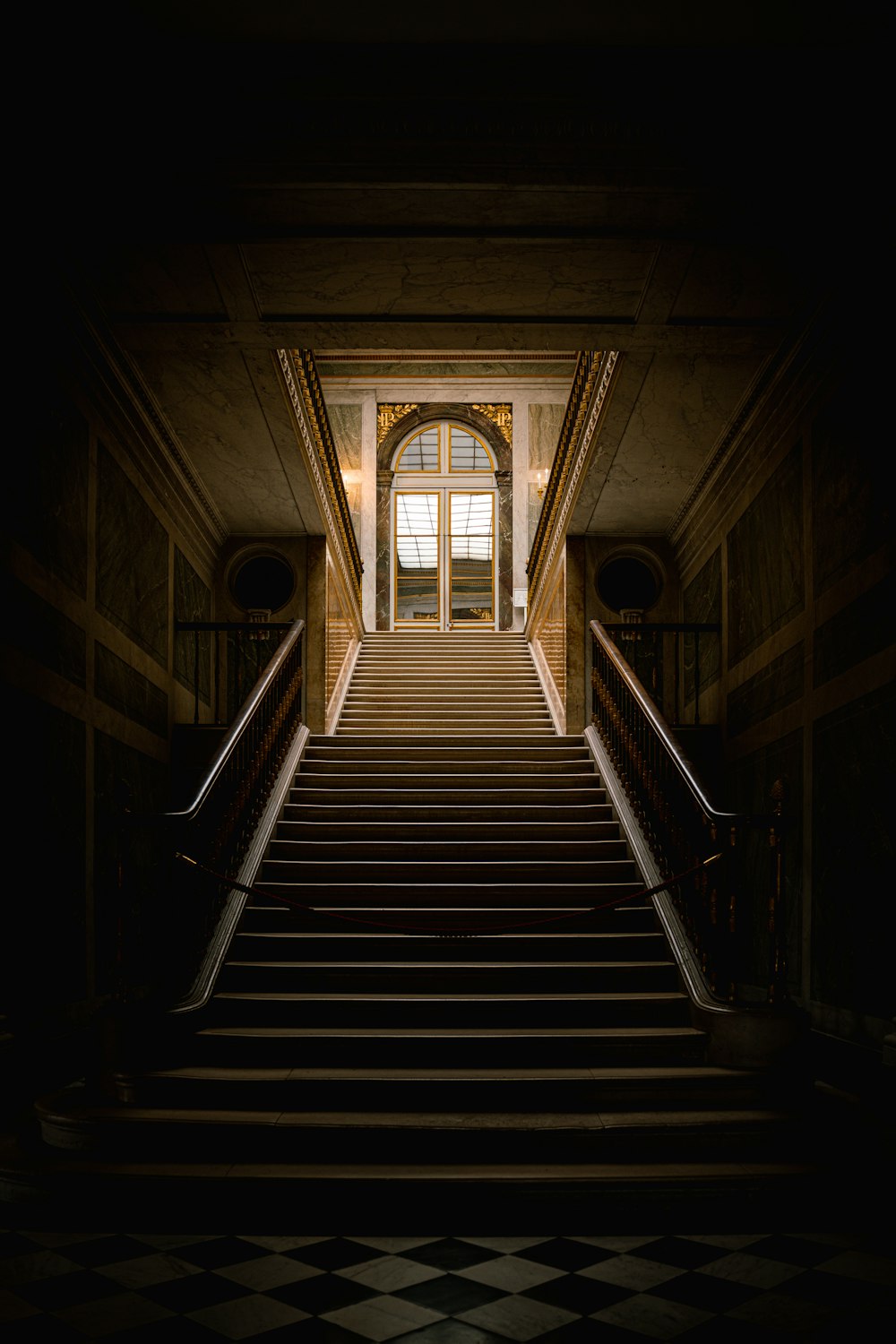 a staircase leading up to a window in a building