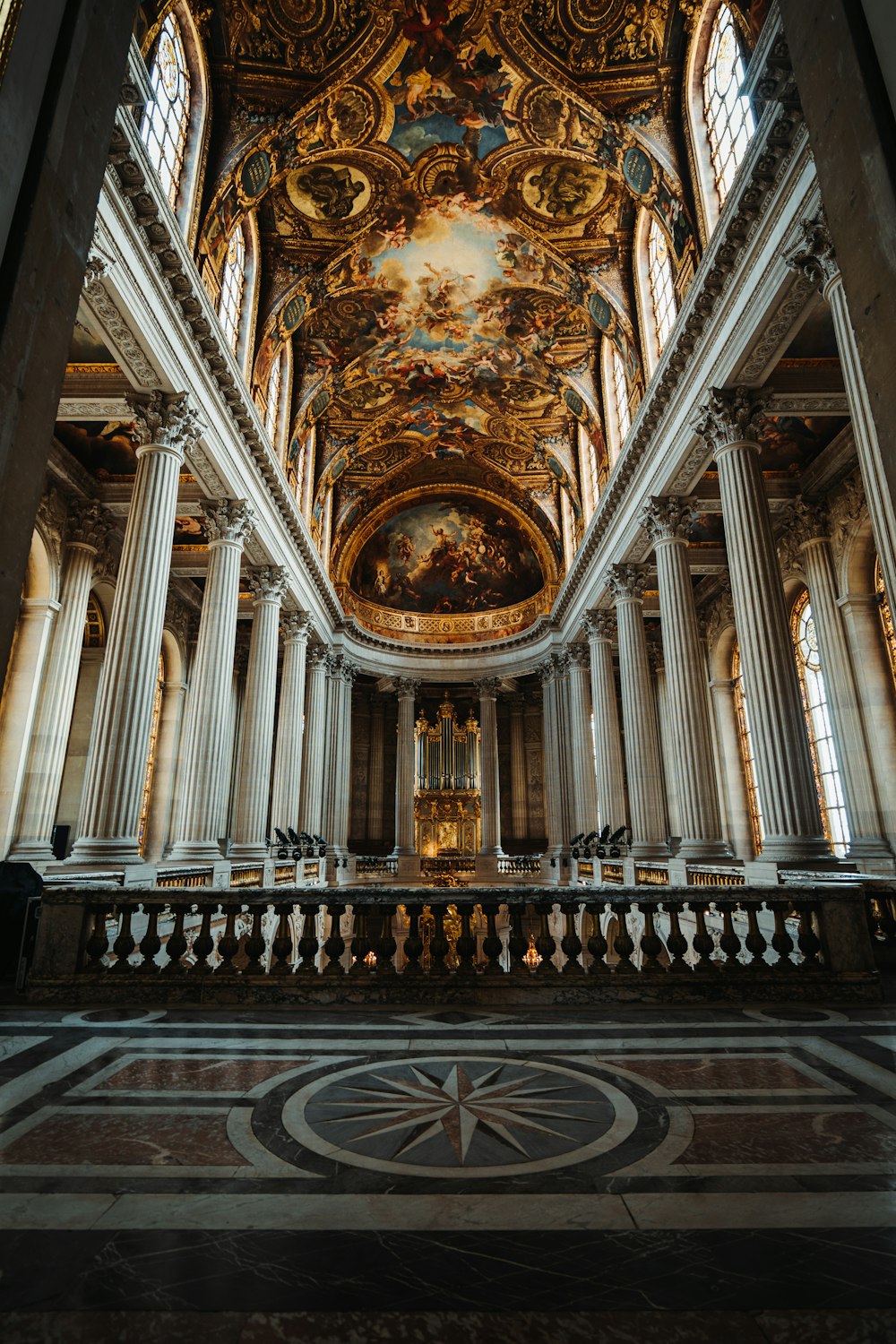 the ceiling of a church with a painting on it