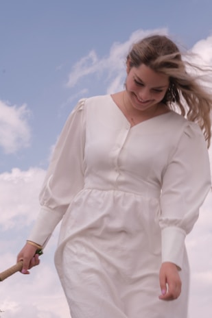 A model wearing a soft, breathable cotton outfit from advitya, standing outdoors with a gentle breeze, smiling comfortably.