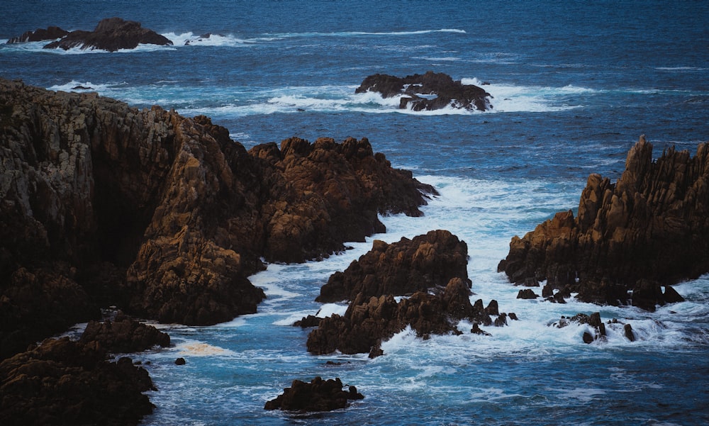 a large body of water surrounded by rocks