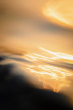 An abstract swirl of soft golden light symbolizing the beginning of a personal journey.