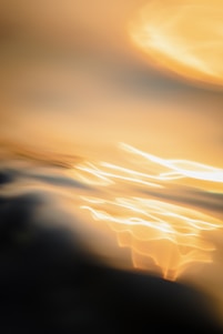 An elegant gold-themed abstract background with a subtle glow symbolizing wealth and growth.