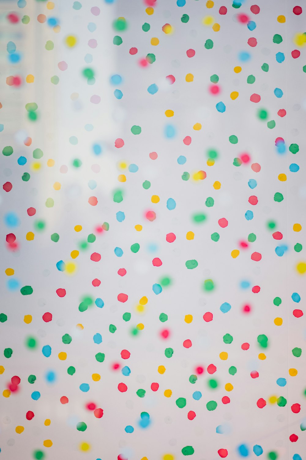 multicolored confetti on a white background