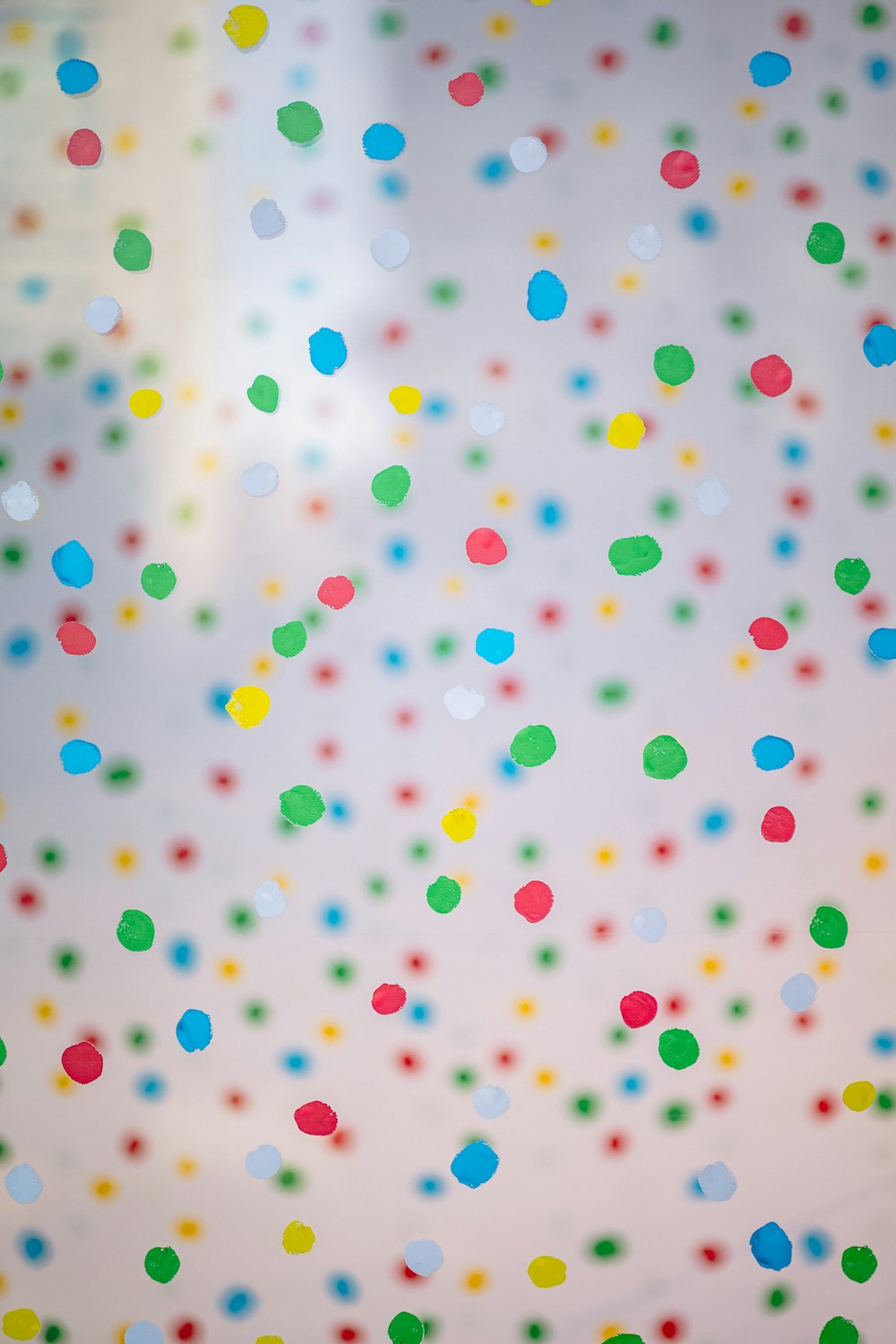 multicolored confetti on a white background