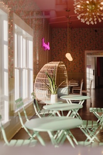 Cozy corner of the restaurant with soft beige lighting and mint green accents, inviting guests to relax
