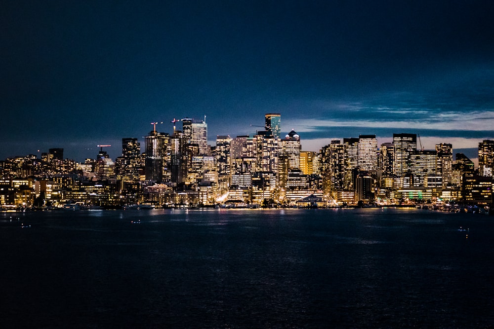 a view of a city at night from across the water