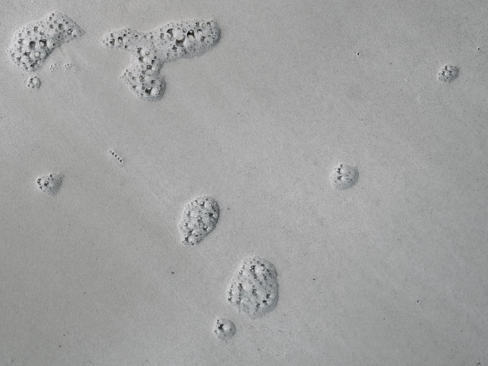 a group of footprints in the sand on the beach