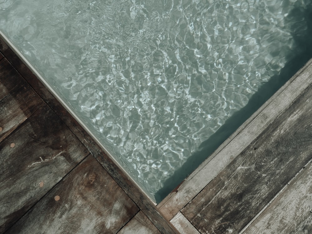 a wooden dock with water inside of it