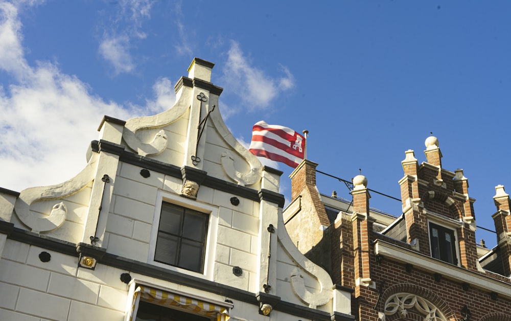 an american flag flying on top of a building