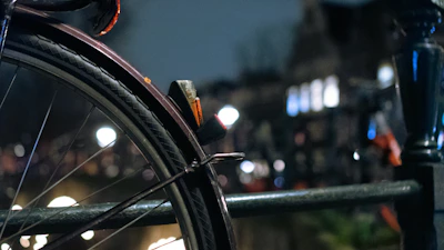 Close-up of a sleek urban motorcycle tire on a city street background