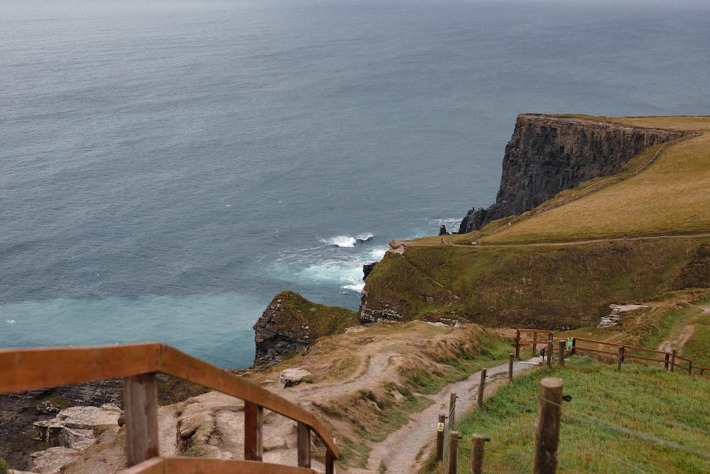 a view of the ocean from the top of a hill