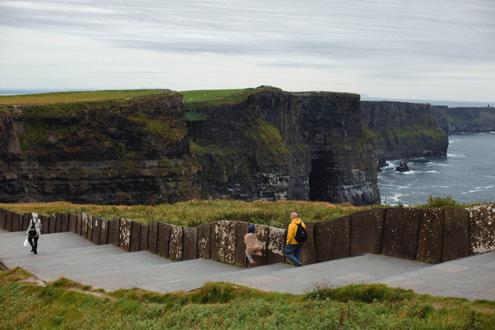 a couple of people that are standing on some steps