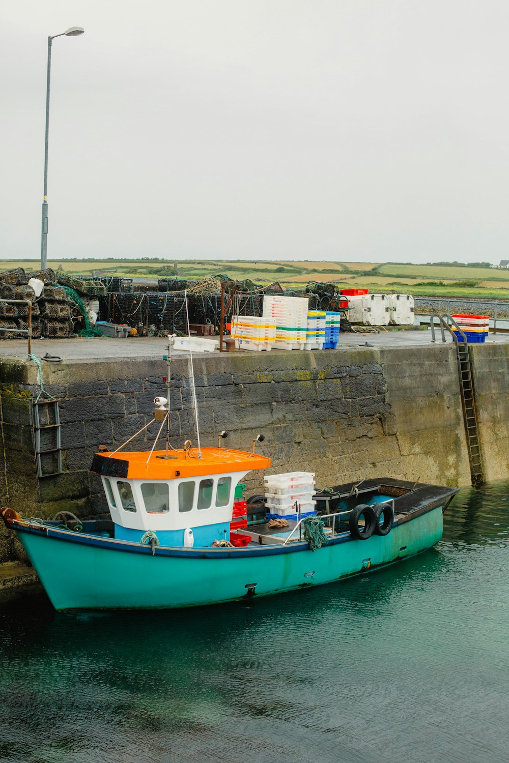 a blue and white boat in a body of water