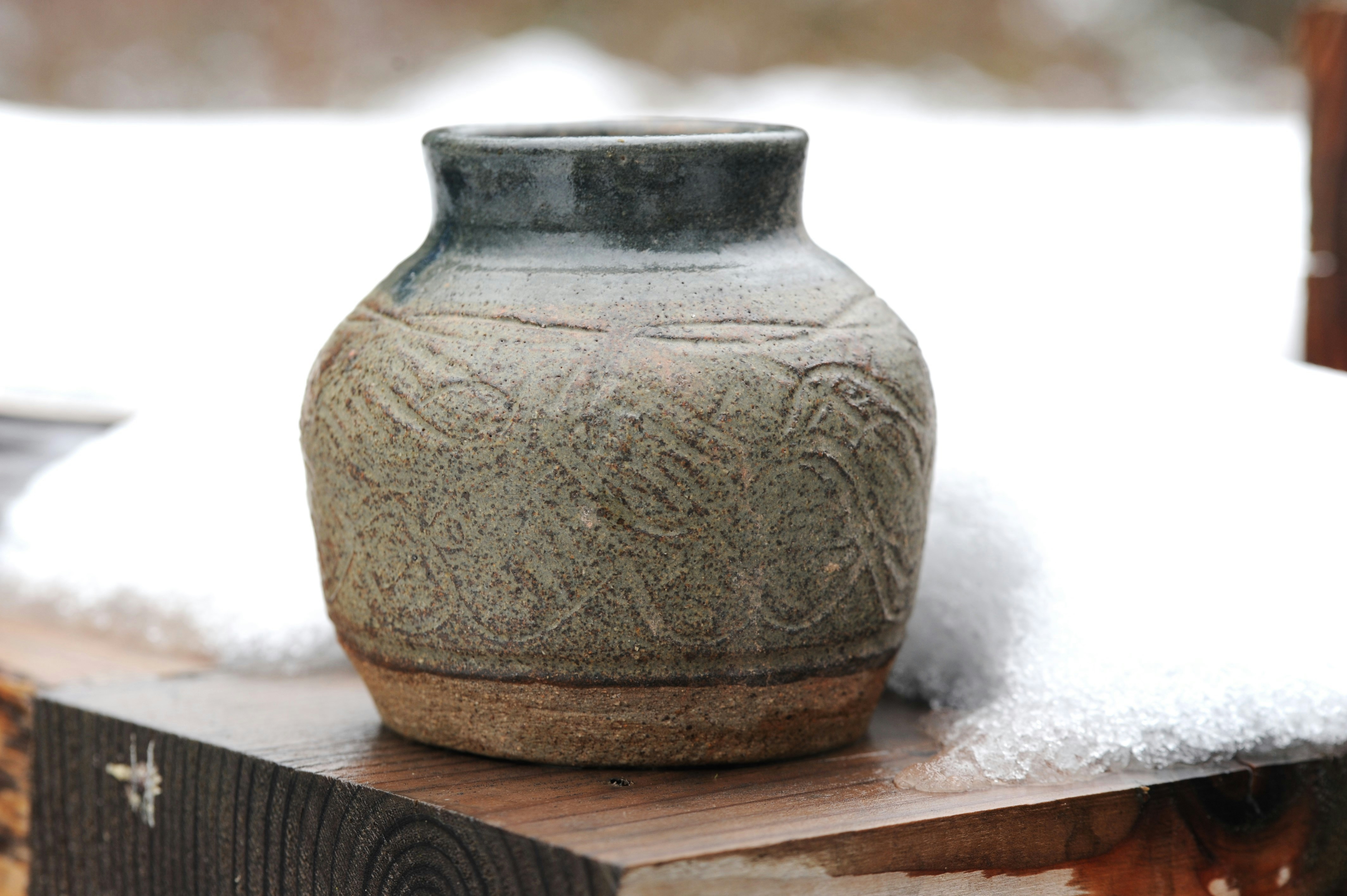 person wearing grey knit sweater