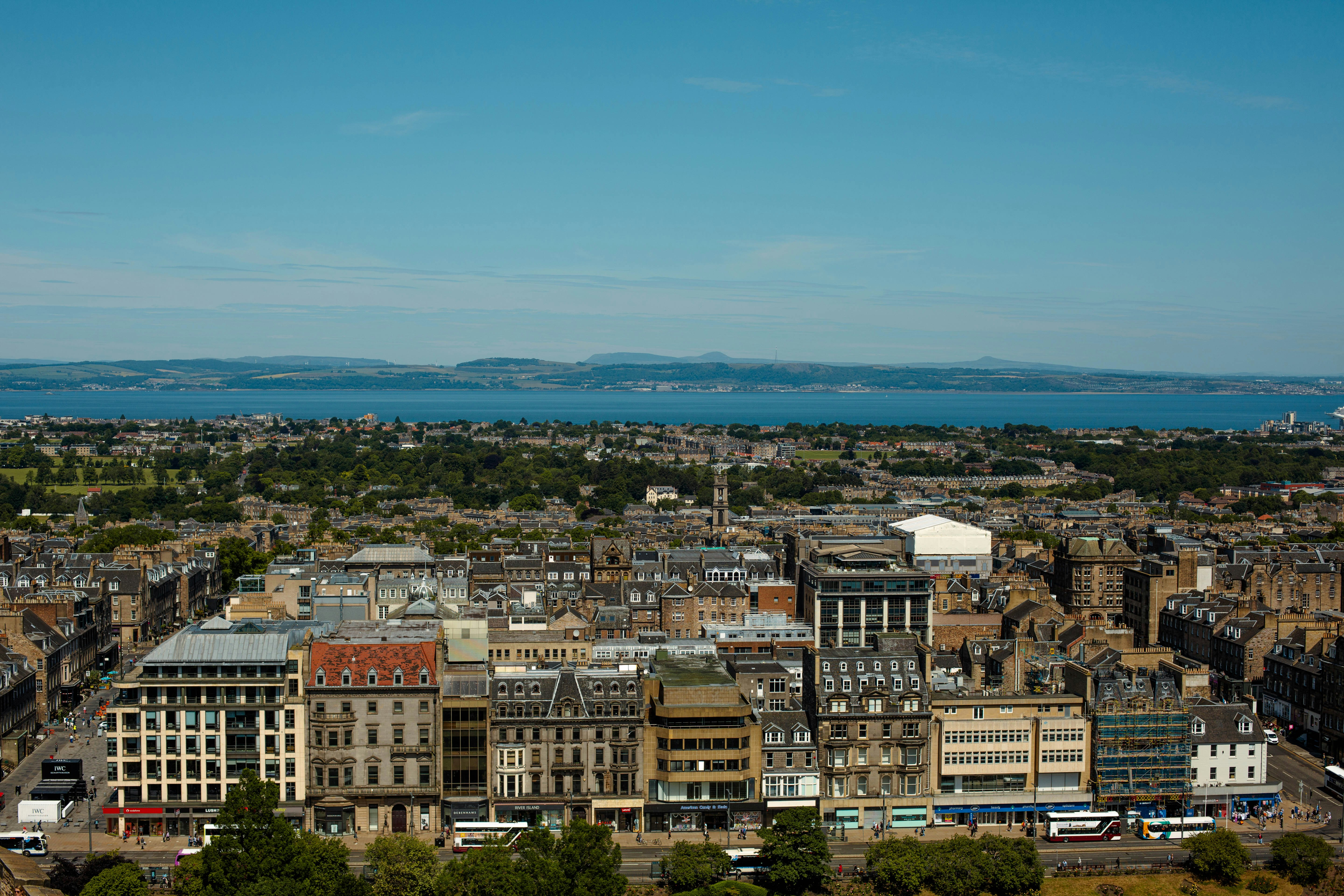 a view of a city with a body of water in the distance