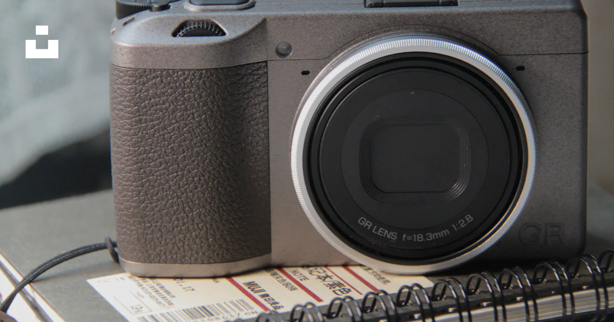 Camera Notepad A camera sitting on top of a notebook photo – Free Camera Image on Unsplash