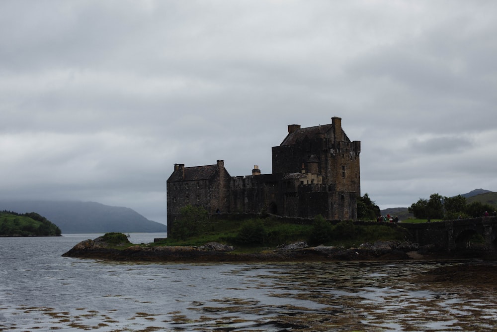 a castle sitting on top of a small island