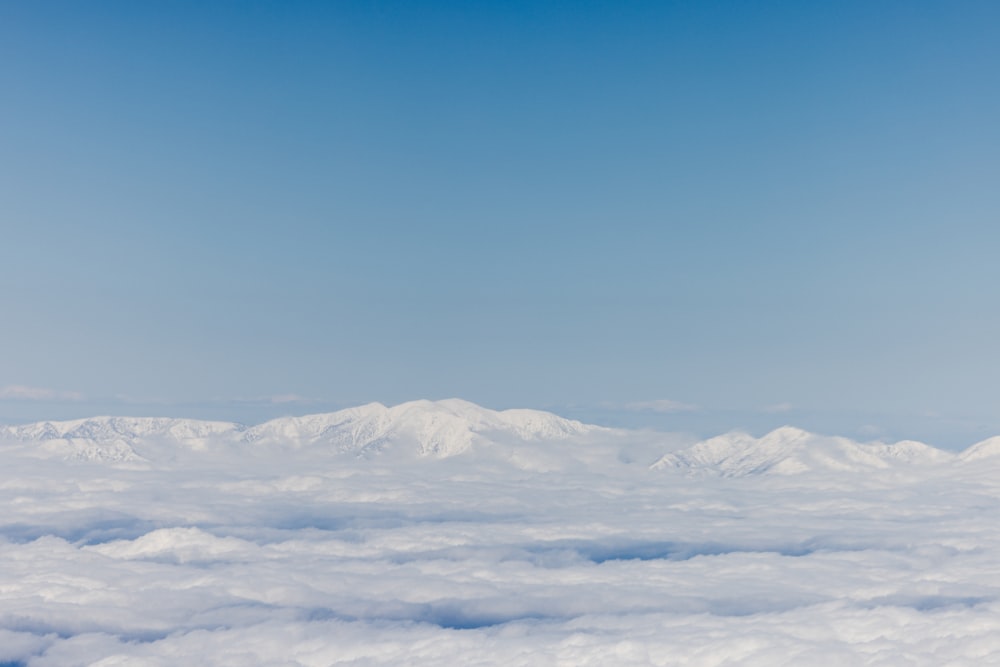 a view of a mountain range from above the clouds