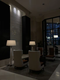 Guests networking in an intimate lounge area with dark, stylish furnishings.