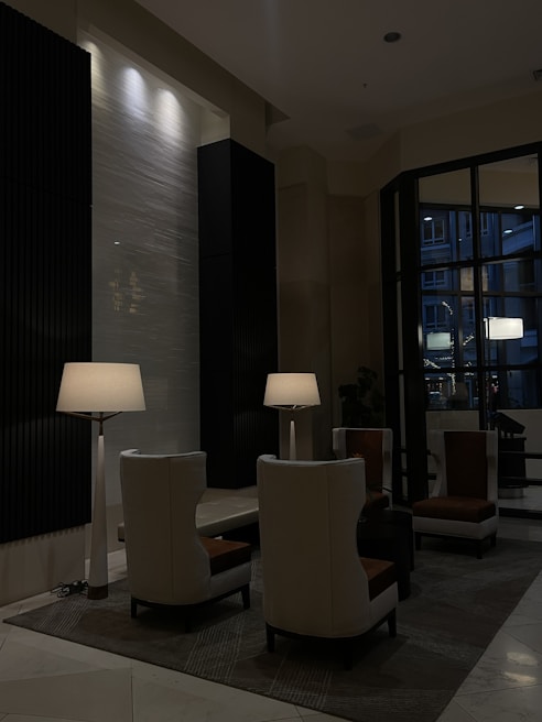 An elegant hotel lounge featuring luxurious seating and ambient lighting.