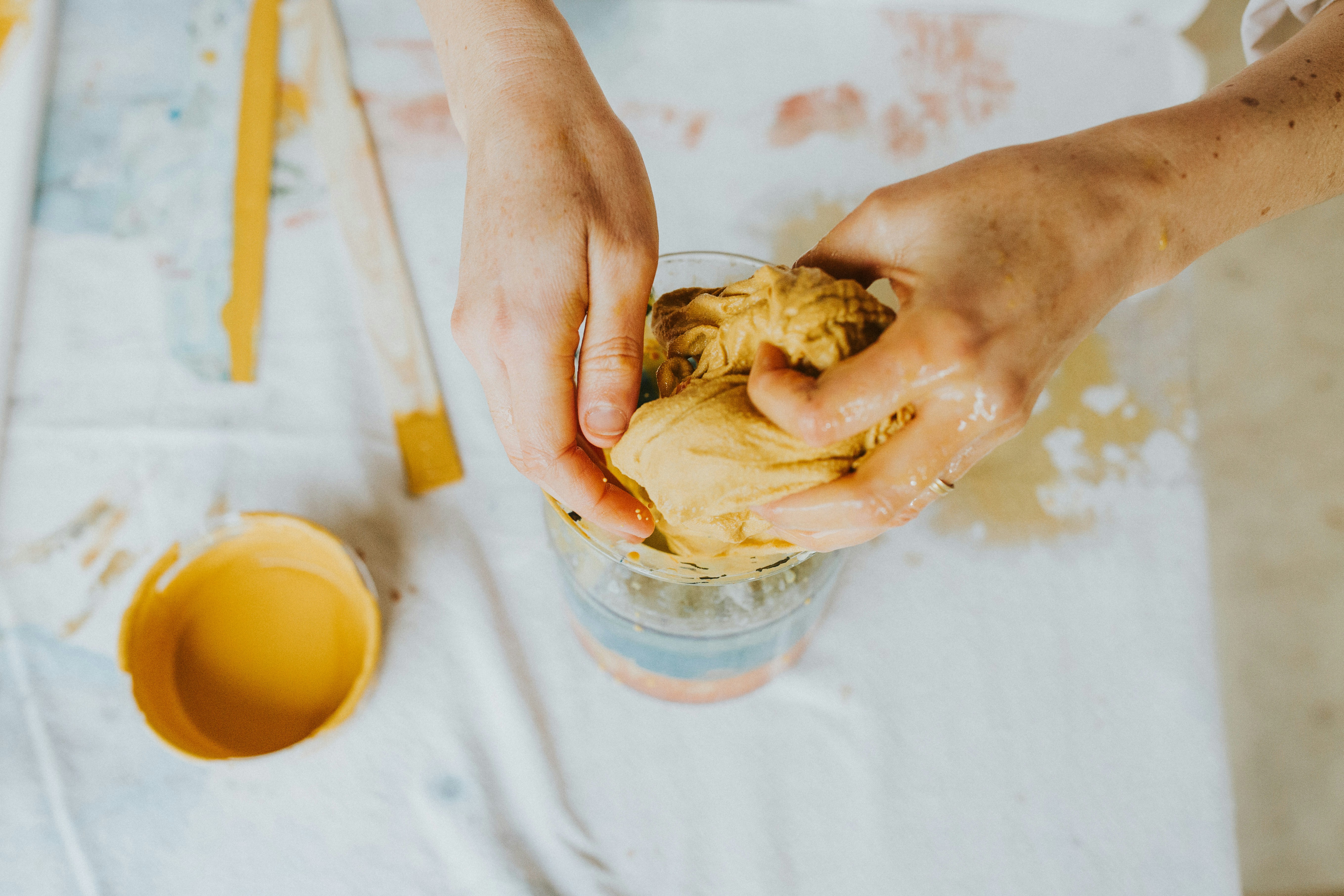 a person is putting something in a cup