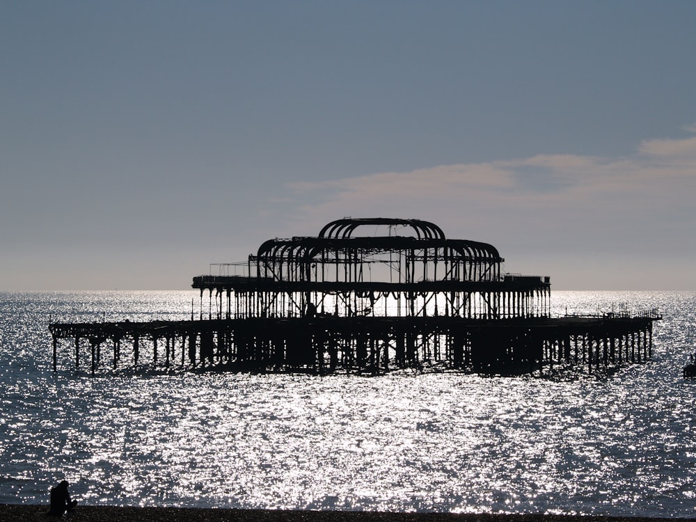 a large structure sitting on top of a body of water