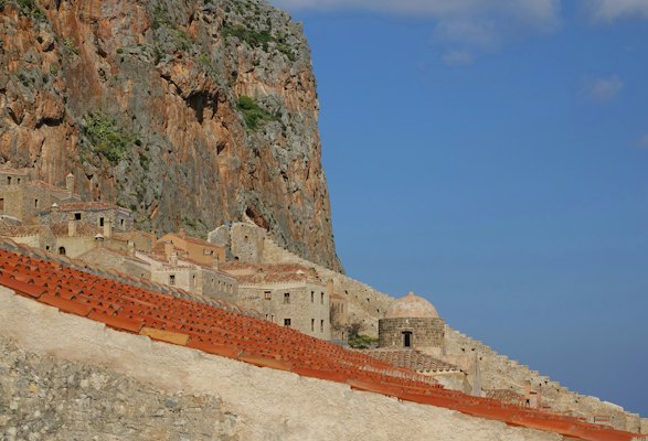 A mountain side with a bunch of buildings on top of it — Monemvasia, Greece