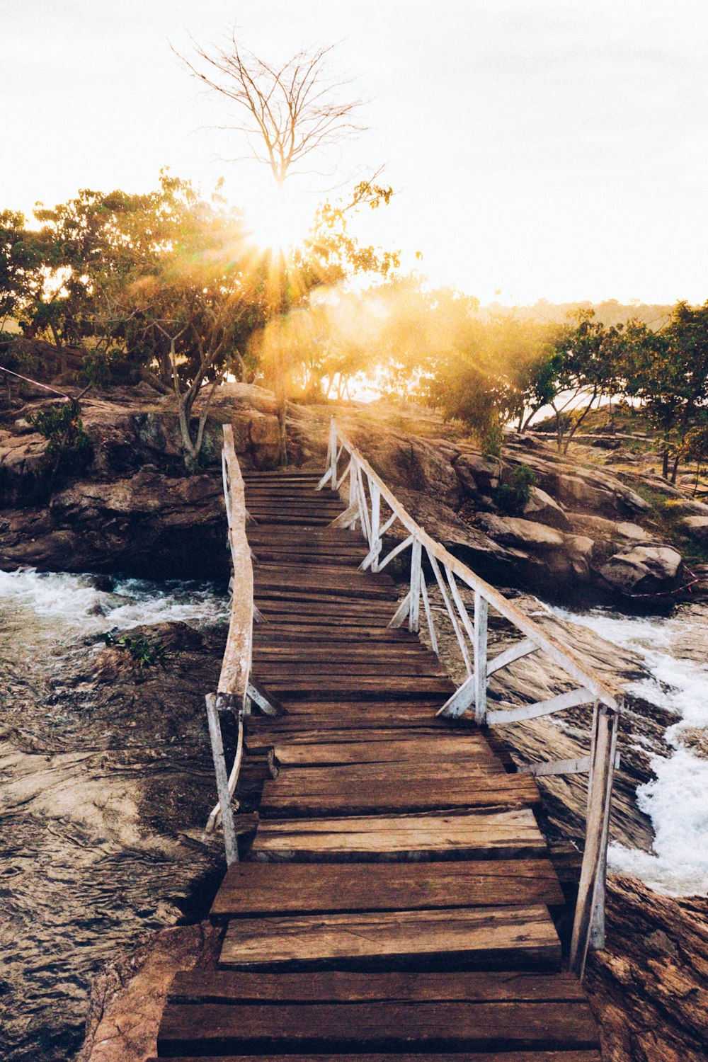 a wooden bridge over a body of water