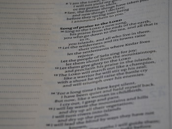 Text from a religious book printed on a page, focusing on a section titled 'Song of praise to the Lord'. It includes verses with poetic language praising divine qualities and actions.