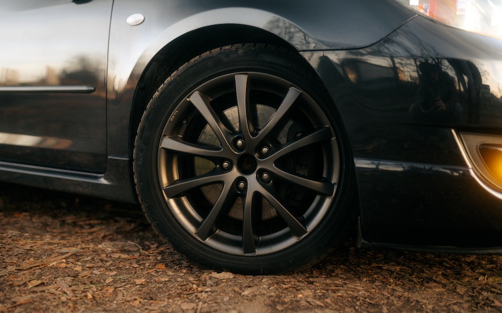 a close up of a car tire on the ground