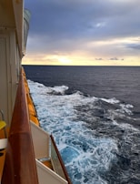 A merchant navy cadet aboard a ship, looking out over the ocean during training.