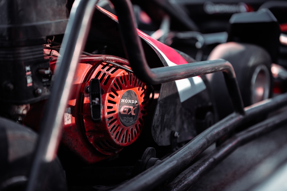 a close up of a red and black engine