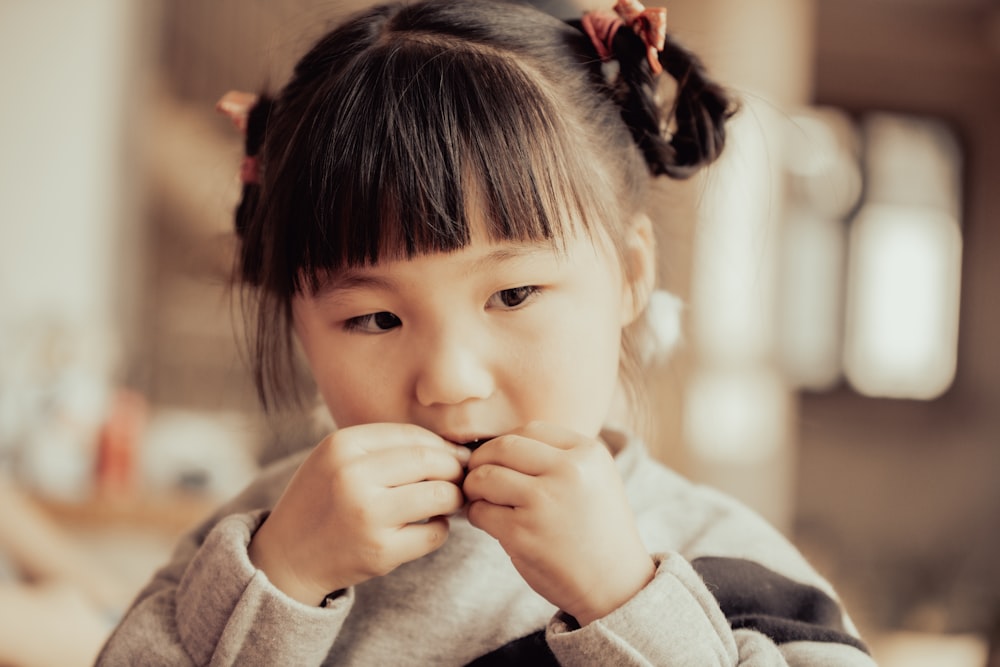 a little girl with a bow in her hair