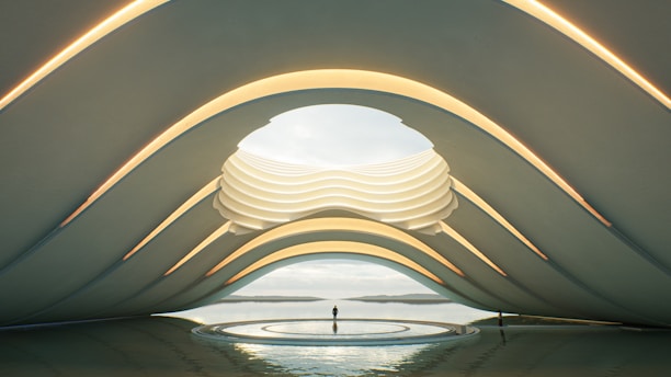 a futuristic building with a man standing in the middle of it