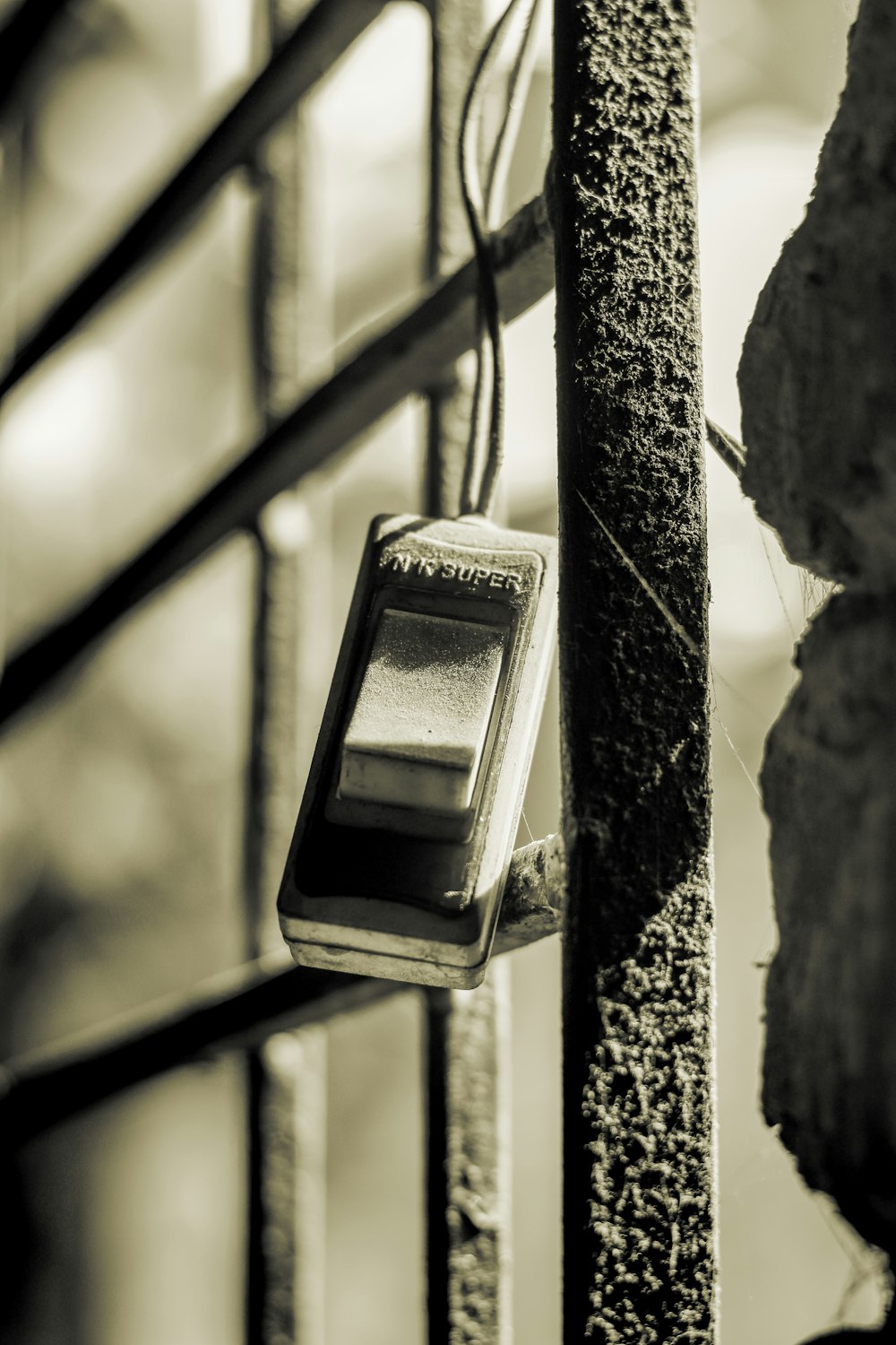 a black and white photo of a light switch