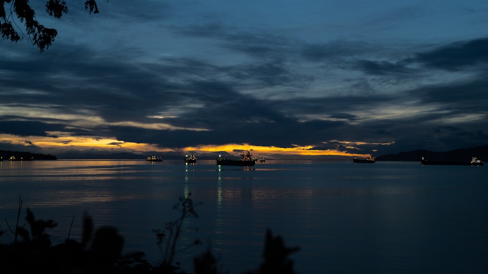 a large body of water under a cloudy sky