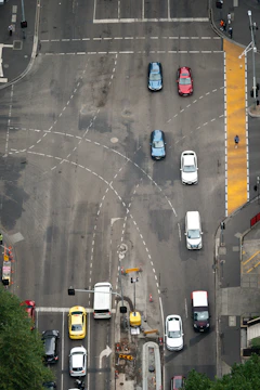 A busy urban intersection with synchronized traffic lights improving vehicle movement.