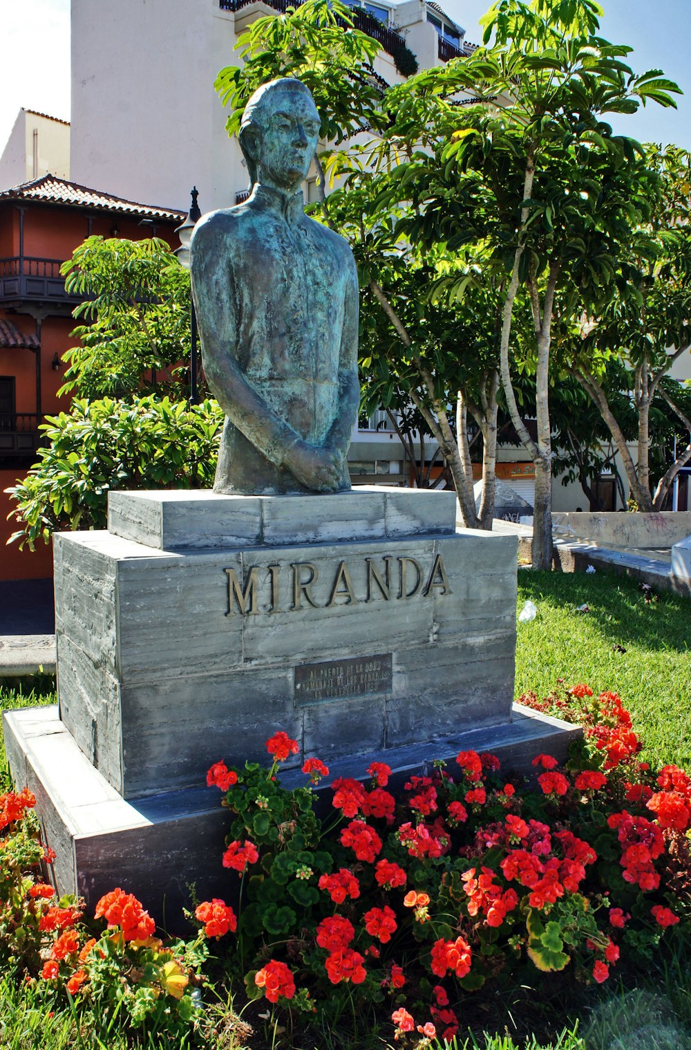 a statue of a man sitting on top of a wooden box