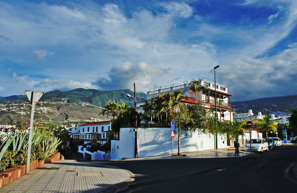 a view of a street with a building in the background