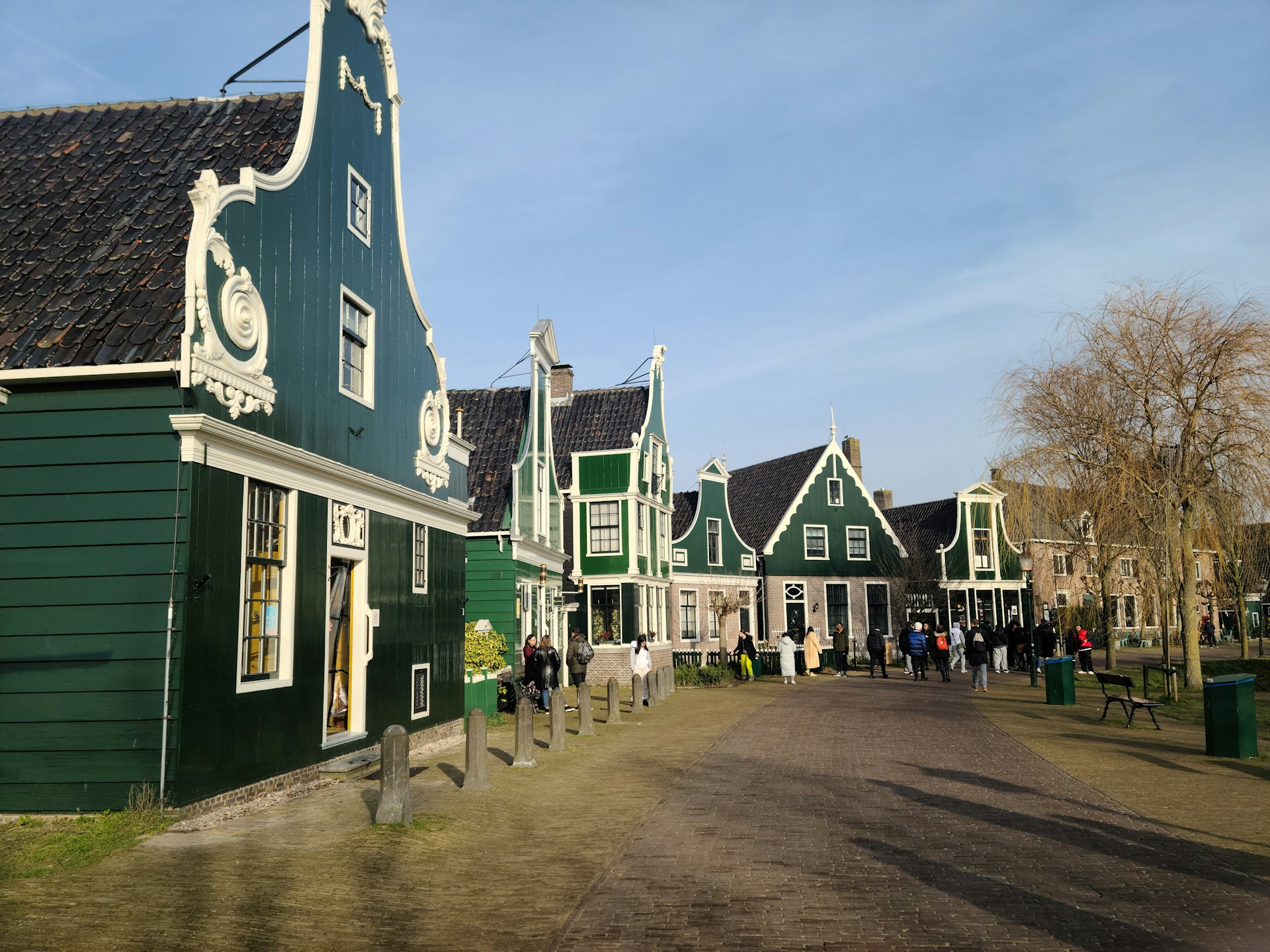 woman wearing yellow long-sleeved dress under white clouds and blue sky during daytime